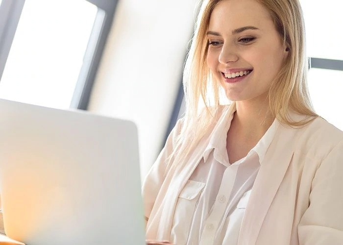 smiling woman with laptop