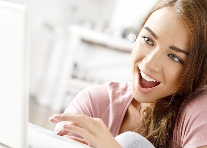 happy woman with laptop